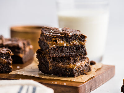 A fudgy recipe for homemade dulce de leche brownies made with cocoa powder, chocolate chips, and a layer of decadent dulce de leche. | peteandgerrys.com