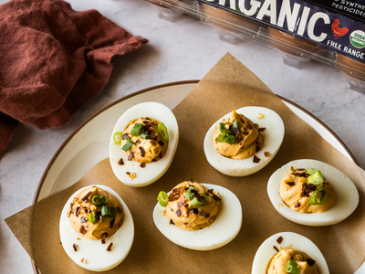 A bold recipe for spicy deviled eggs made with chipotle peppers in adobo sauce and sprinkled with red pepper flakes. | peteandgerrys.com