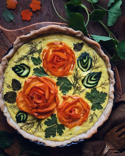 A quiche with the filling arranged in the shape of roses pete and gerry's organic eggs